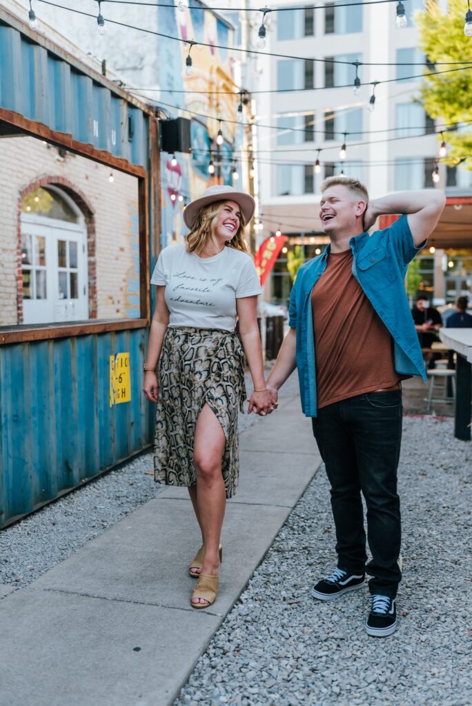 Couple laughing downtown