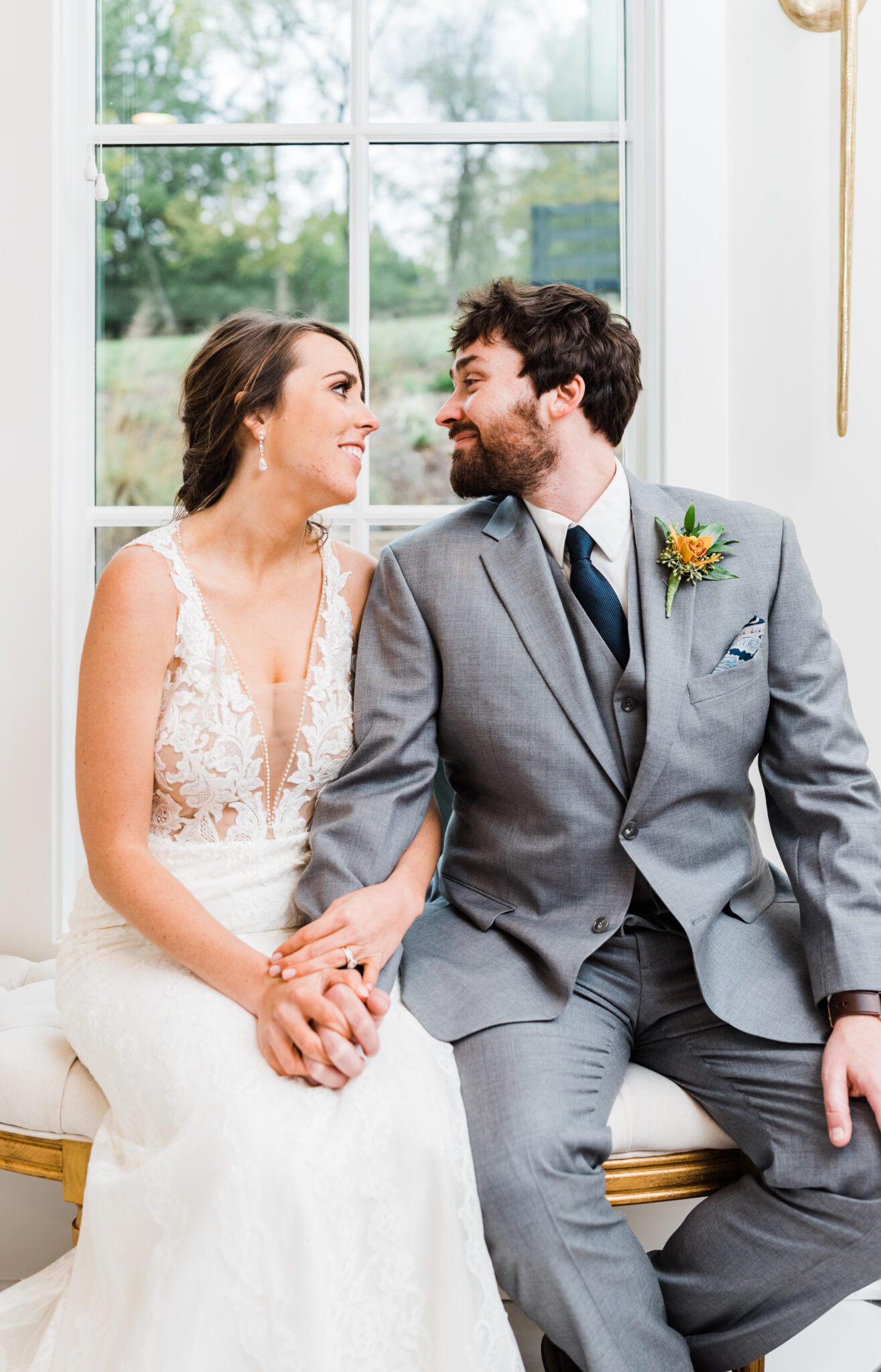 Newlyweds smile at each other