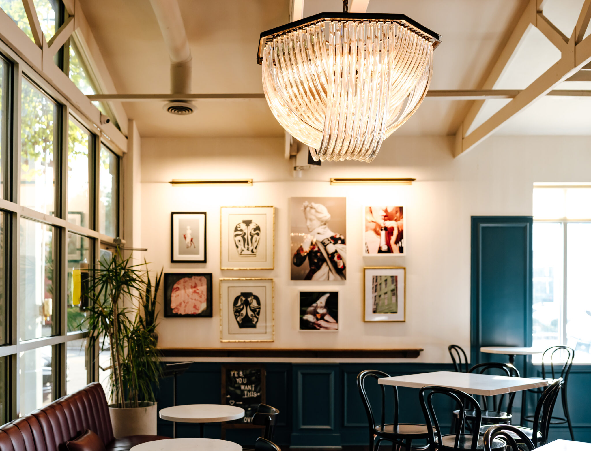 Photograph of a classy wine bar with an art gallery wall