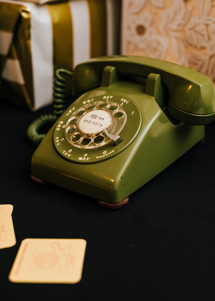 A photo of the old rotary phone being used as an audio guestbook