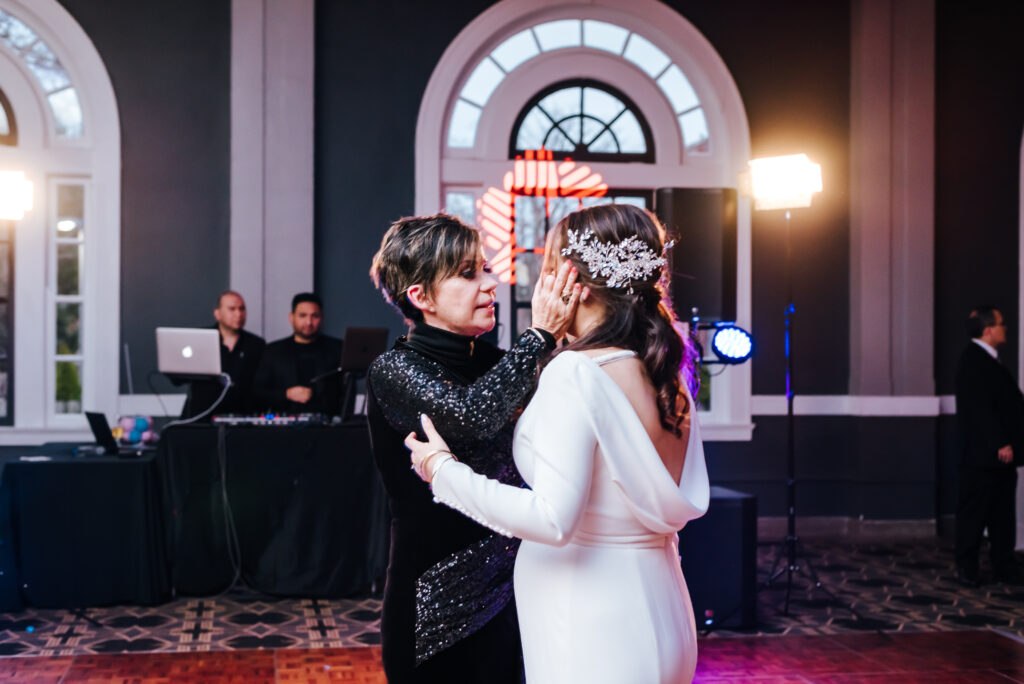 The bride shares an intimate moment with her mother as they dance together