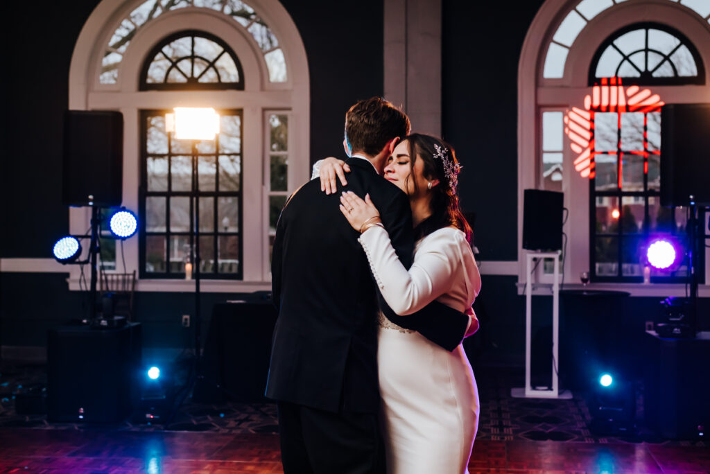 The bride shares a warm hug with her brother for another special dance