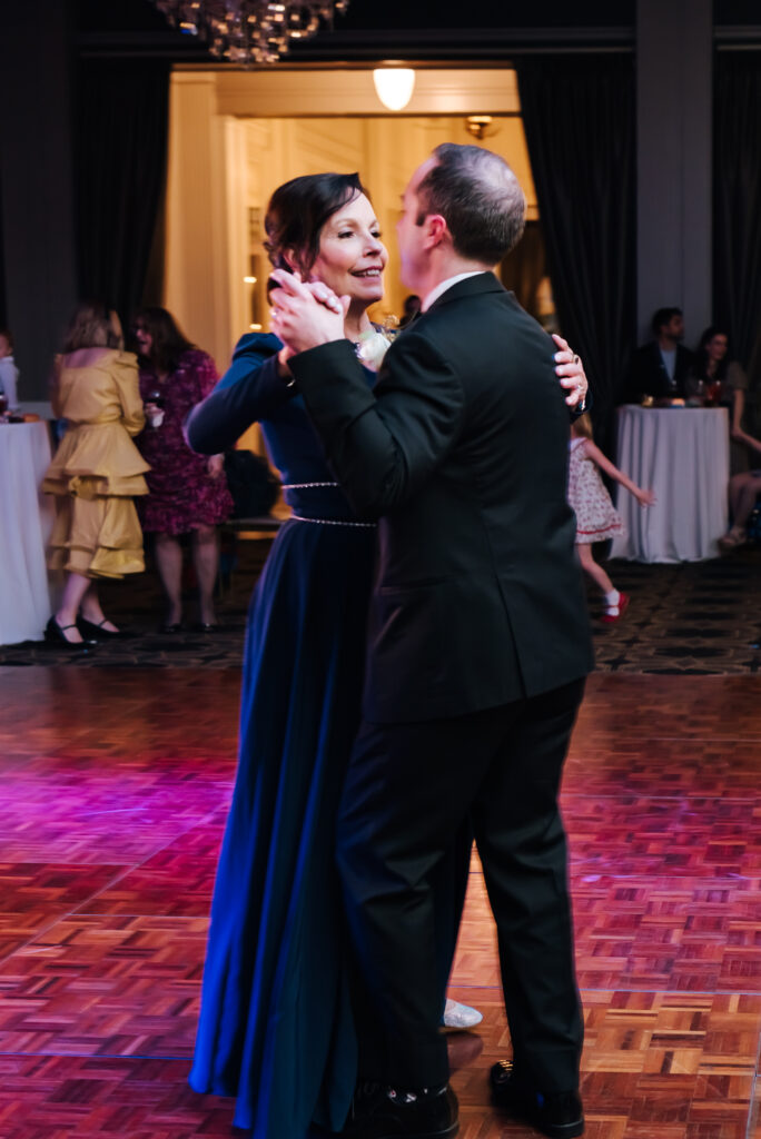 The groom dances a waltz with his mother