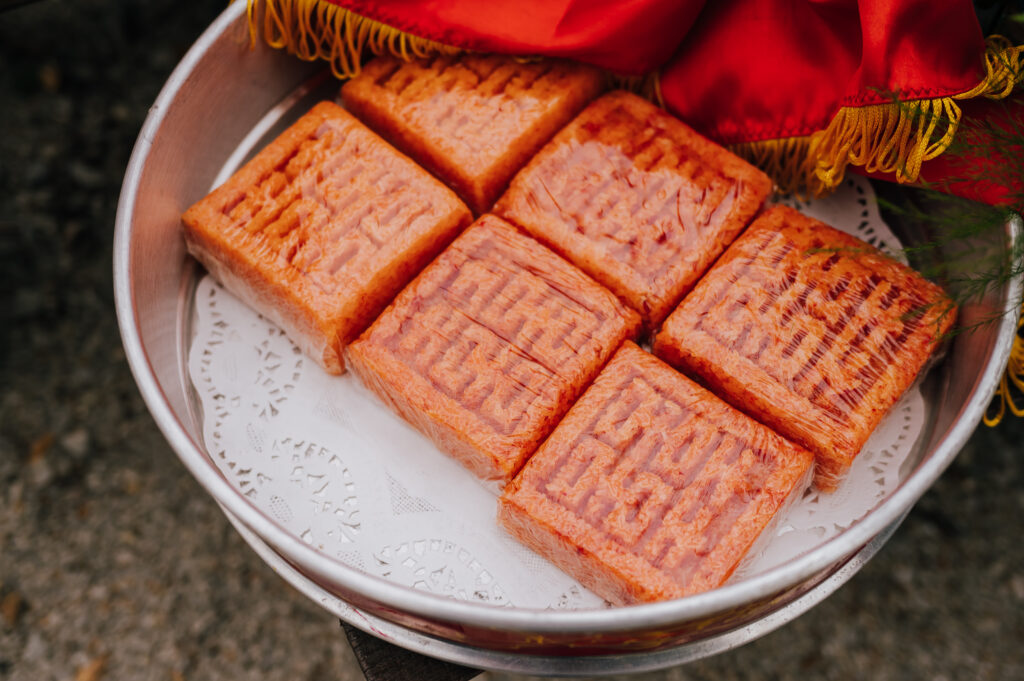 A tray of 6 traditional Vietnamese sweets in the shape for double happiness