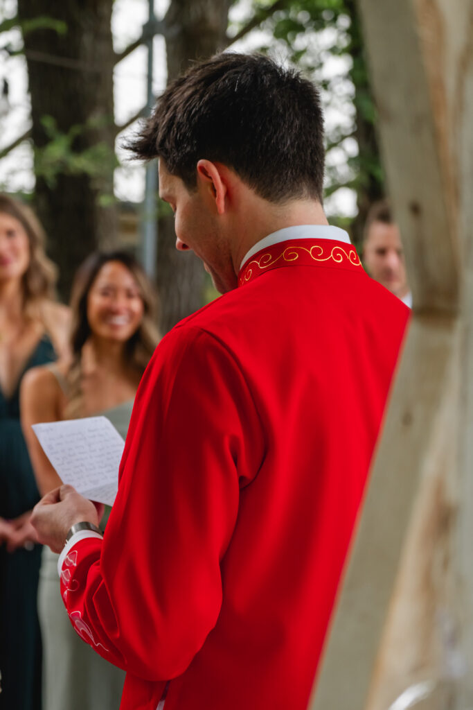 A close up photo of the groom and his vows