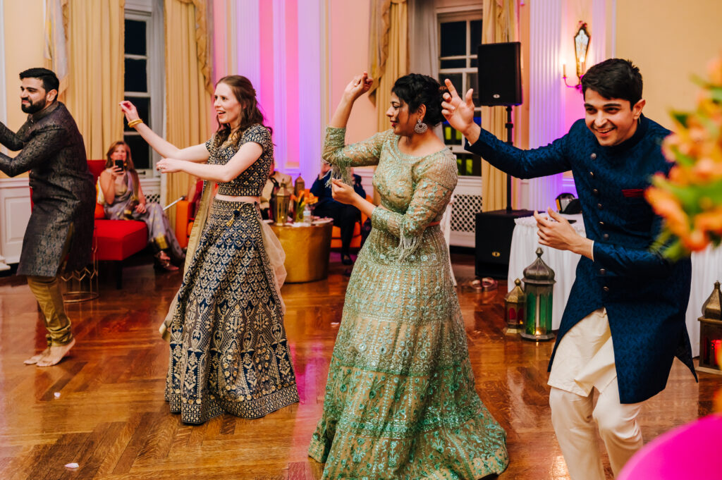 The bride, groom, and their siblings have a dance performance for their guests
