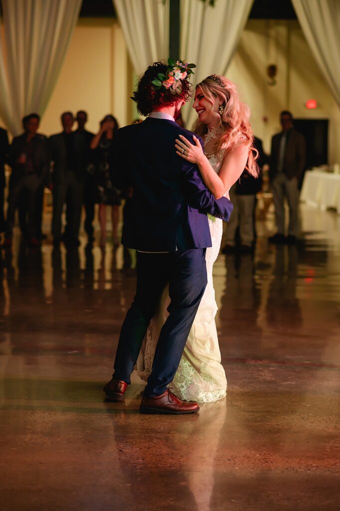 A bride and groom dance inside a Louisville wedding venue.