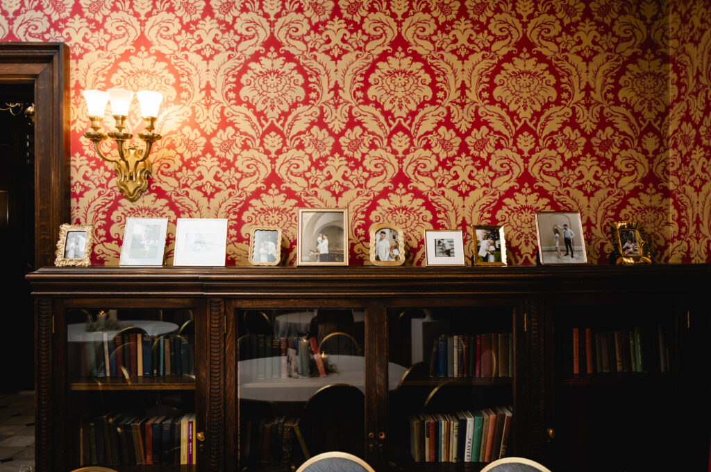 Personalized picture frames filled with the couple's engagement photos sit atop the mantel in one of Gardencourt's interior rooms