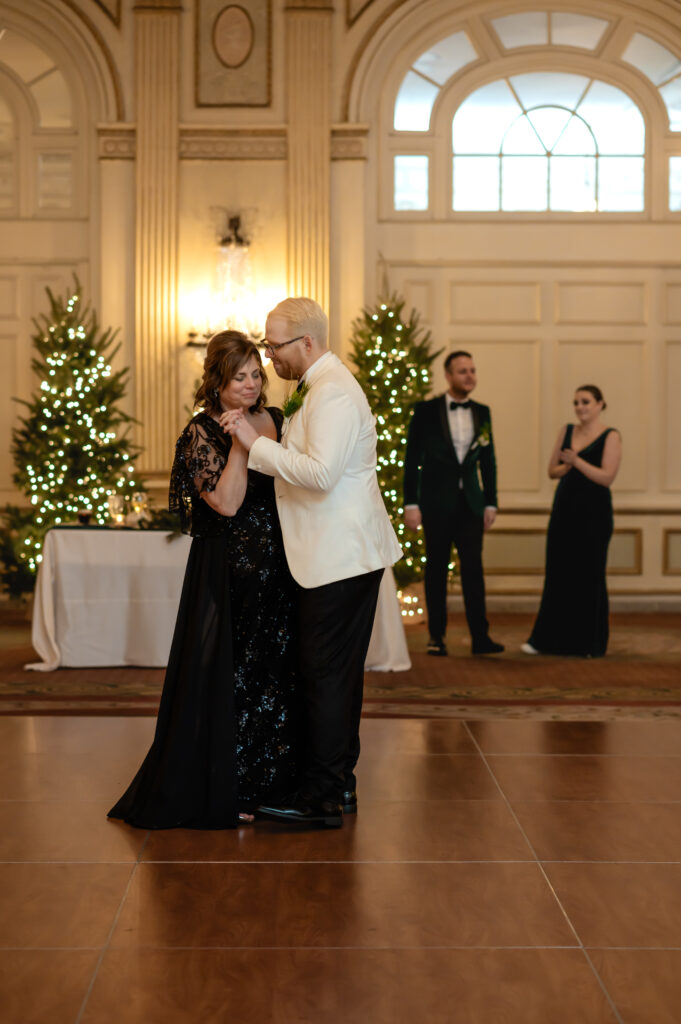 Jared shares a dance with his mother-in-law as Matthew and their maid of honor watch