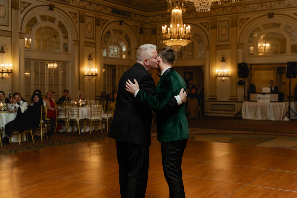 Matthew's father gives him a kiss on his cheek at the end of their dance