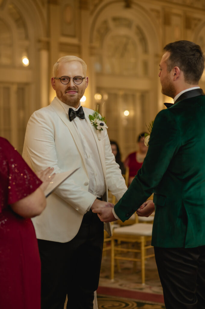 Jared looks towards the officiant as she reads the words she prepared