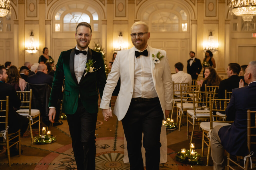 Matthew (left) and Jared (right) exit the ceremony hand in hand