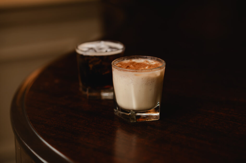 A pair of winter cocktails: an espresso martini and an eggnog cocktail 