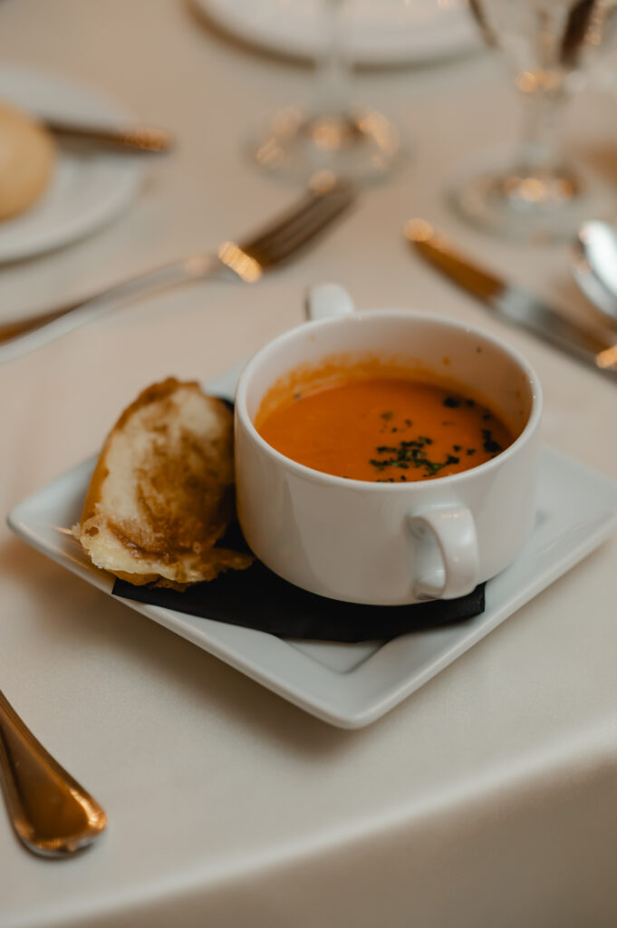 A gourmet tomato basil soup and grilled cheese