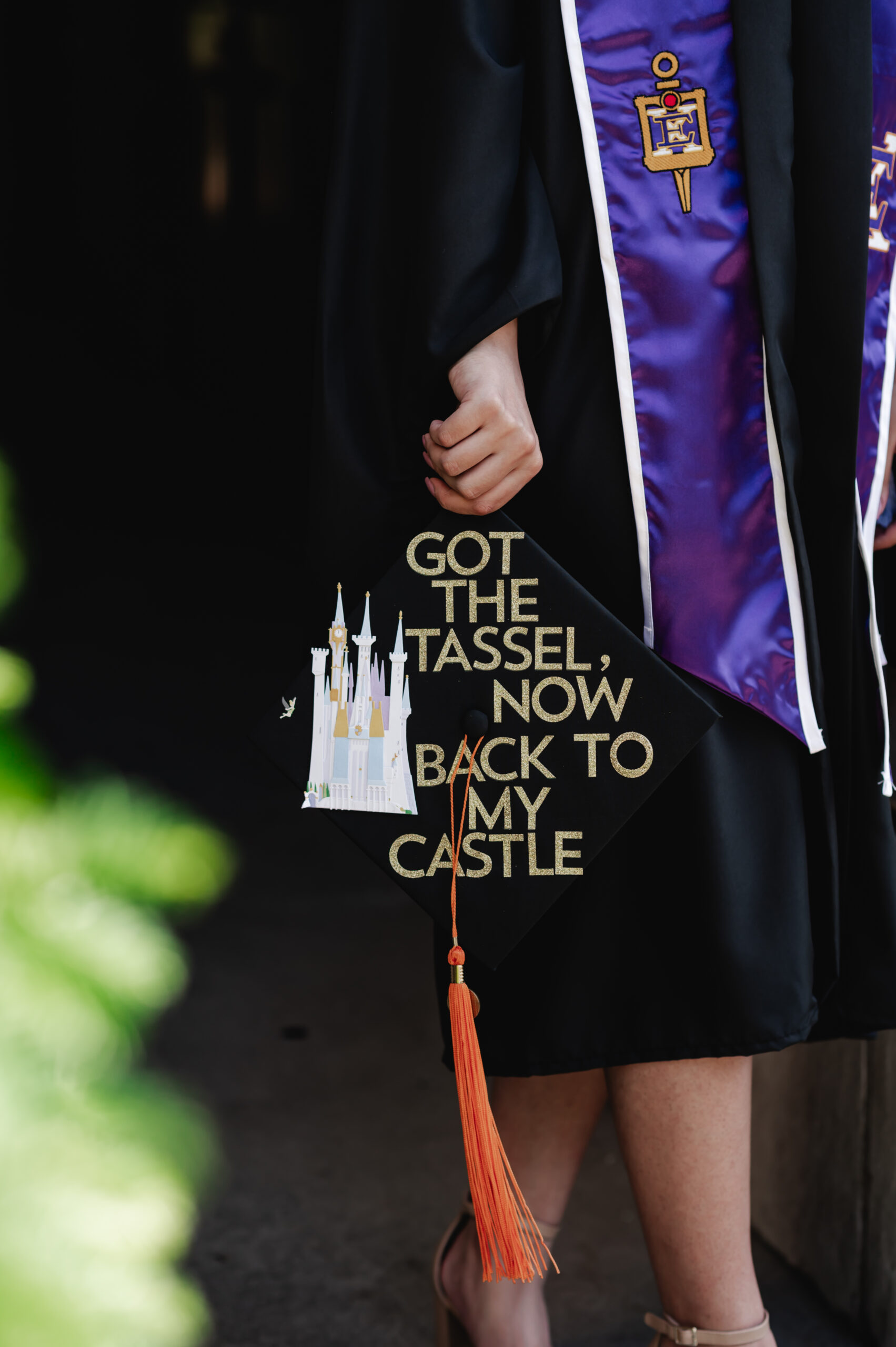 A close up photo of a graduation cap that says "got the tassel, now back to my castle"