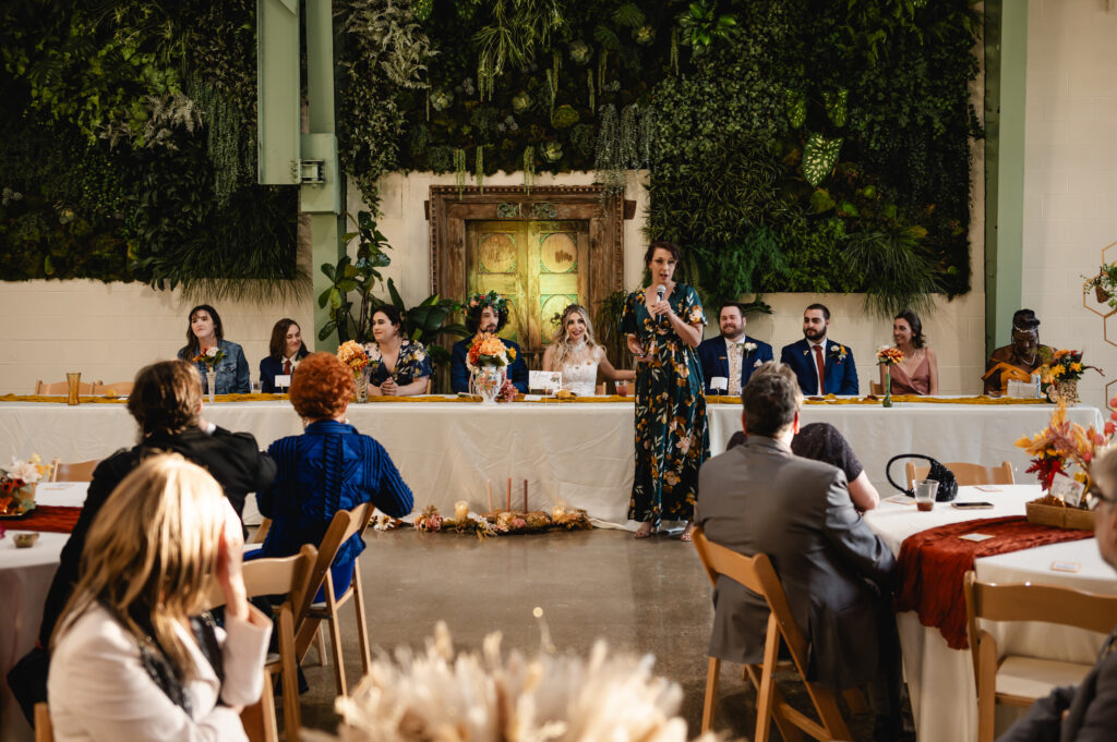 A maid of honor gives a toast in the reception hall of Germantown Gables.