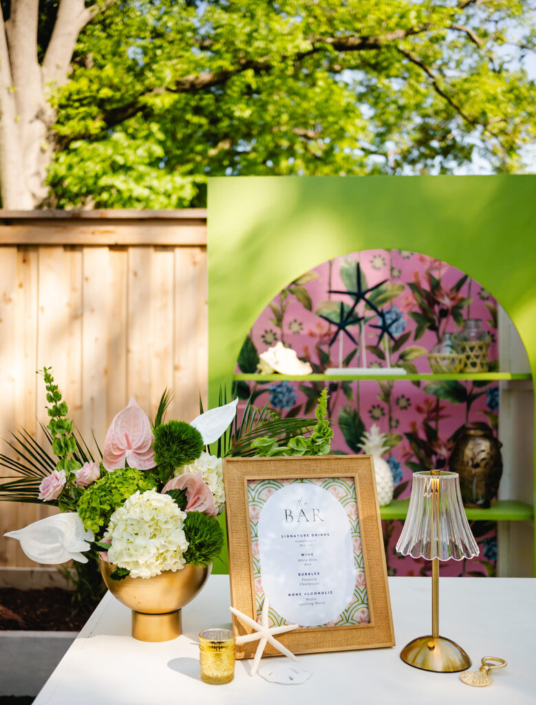 A chic, Palm Royale inspired bar set-up